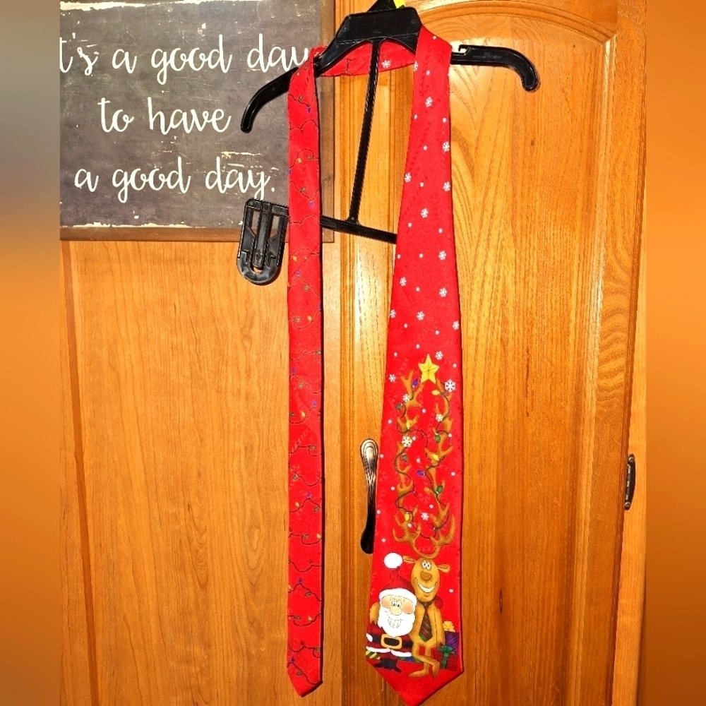 A Hallmark Christmas tie with Santa and Rudolph. Pre-loved in great condition